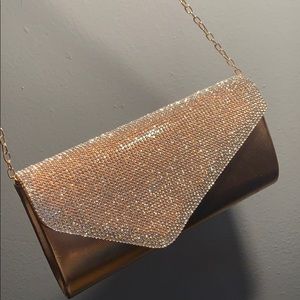 A rose gold clutch